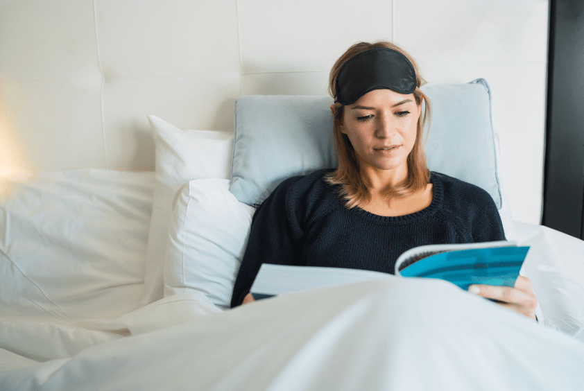 Woman reading in bed