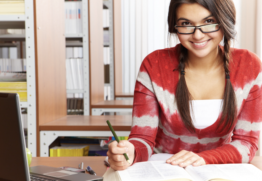 Girl with glasses studying