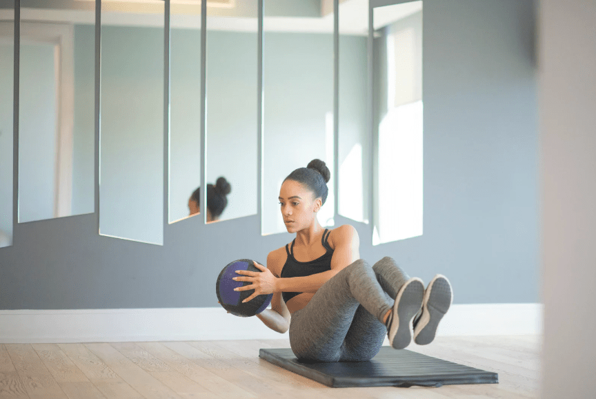 Woman working with a bosu ball